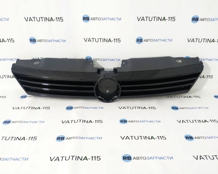 KH9528990 Решетка радиатора -эмбл. (черн.)